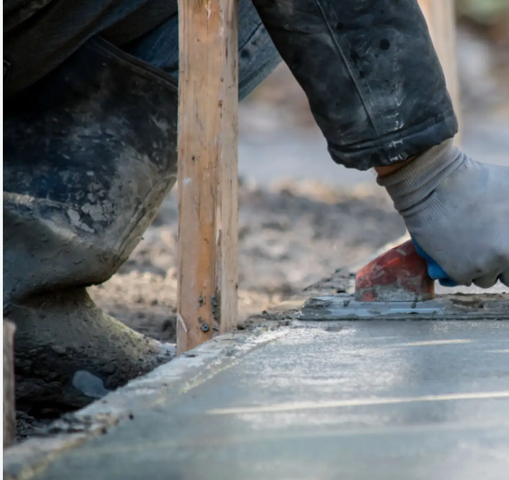 man paving concrete